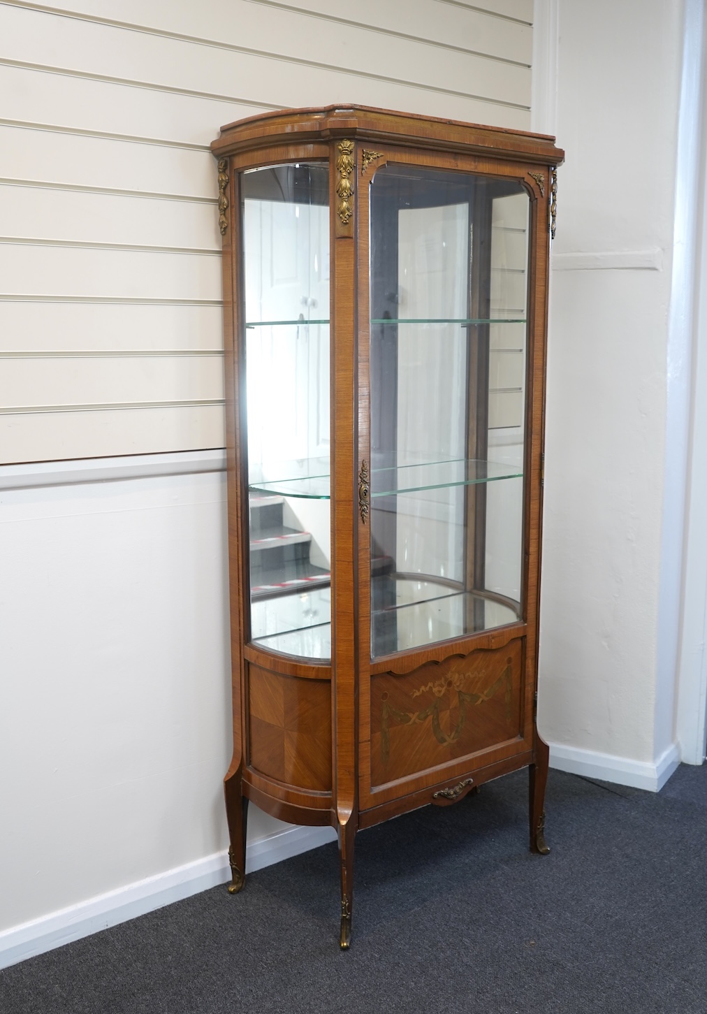 A Louis XVI style marquetry inlaid, gilt metal mounted kingwood vitrine